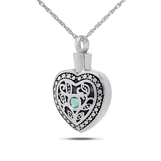 Upright silver pendant set with a pale blue aquamarine above a plain face