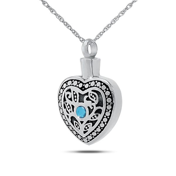 Sterling silver keepsake pendant with a pale blue topaz stone on a polished silver body