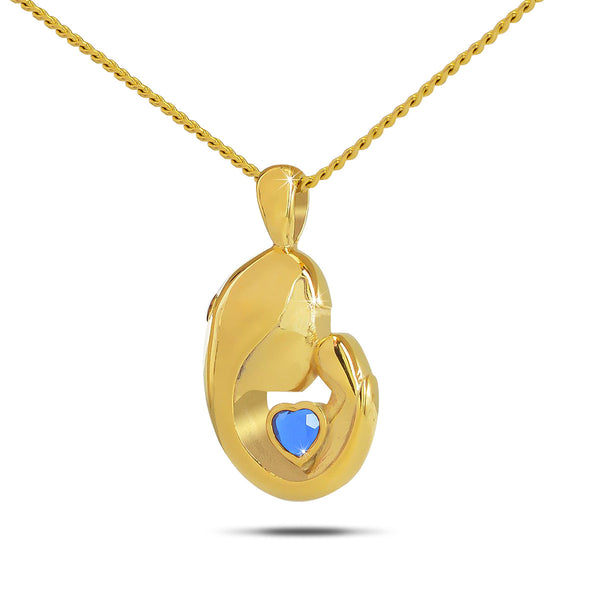 Gold plated steel pendant set with a deep blue sapphire stone, about an inch tall