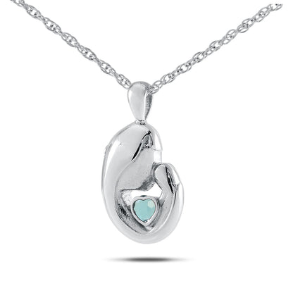 Polished stainless steel keepsake with a heart-shaped pale blue aquamarine stone