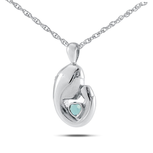 Polished stainless steel keepsake with a heart-shaped pale blue aquamarine stone