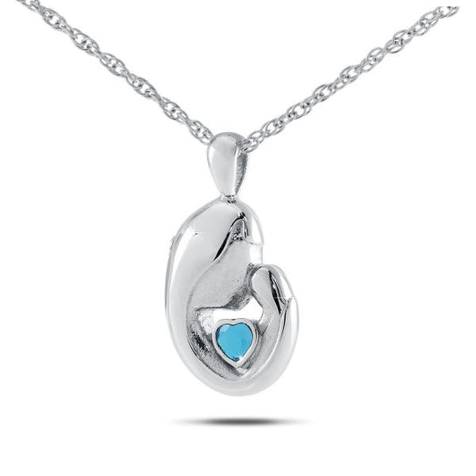 Stainless steel keepsake urn with a heart cutout and a pale blue topaz stone