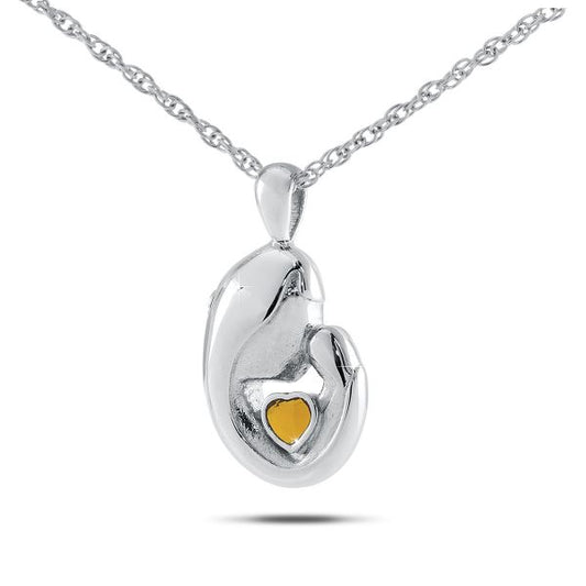 Small sterling silver keepsake pendant set with a golden-yellow citrine stone