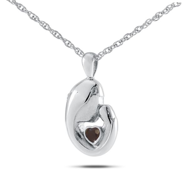 Round sterling silver keepsake pendant set with a deep red ruby at its centre