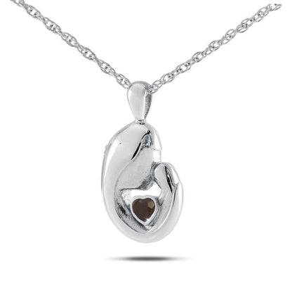 Round sterling silver keepsake pendant set with a deep red ruby at its centre