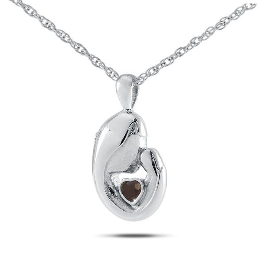 Round sterling silver keepsake pendant set with a deep red ruby at its centre