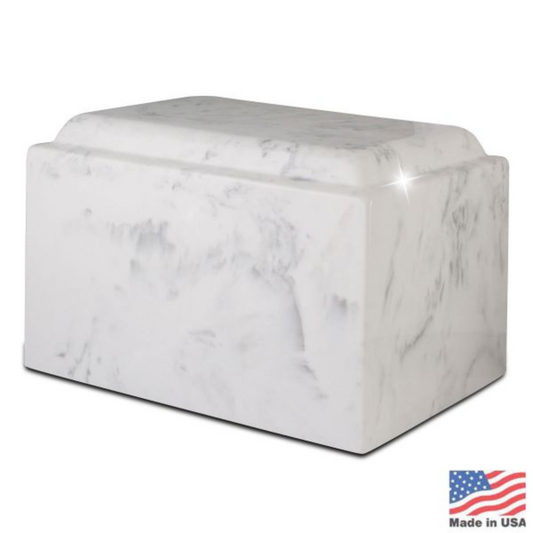 Rectangular white stone cremation urn with soft gray veining and a flat top