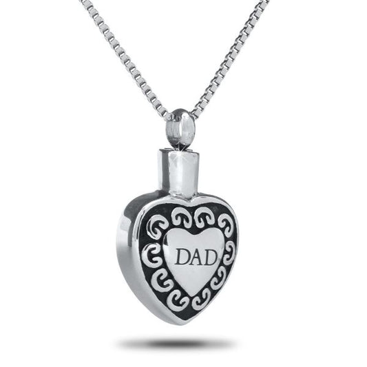 Stainless steel heart pendant engraved with the word Dad, hanging from a steel chain