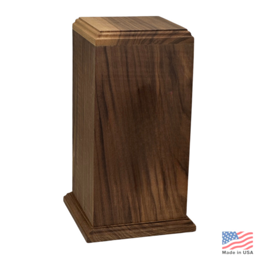 Tall walnut urn in dark chocolate-brown wood with a square base and stepped lid