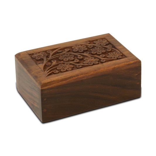 Small wooden pet urn with a daisy motif on the front and a natural wood finish