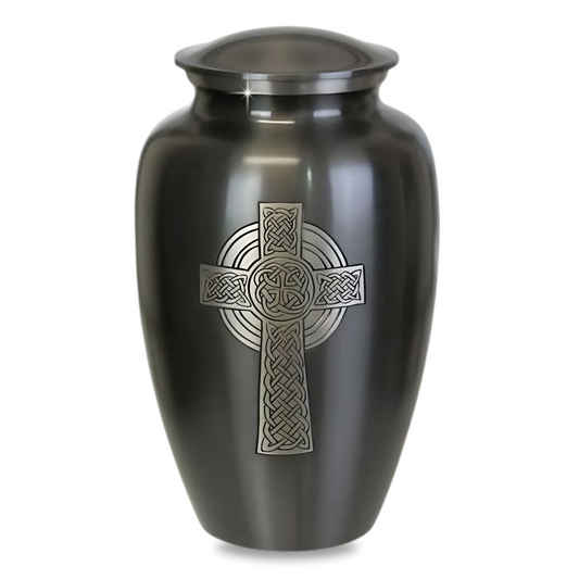 Brass cremation urn with a raised ringed Celtic cross and knotwork on the front panel