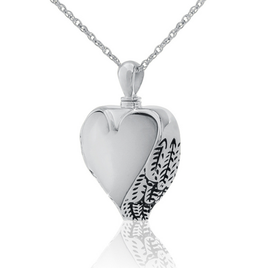 Heart pendant with iridescent mother of pearl inlay set in a stainless steel frame