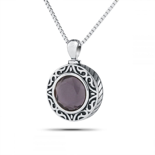 Small stainless steel keepsake with a domed royal purple stone and a polished silver rim