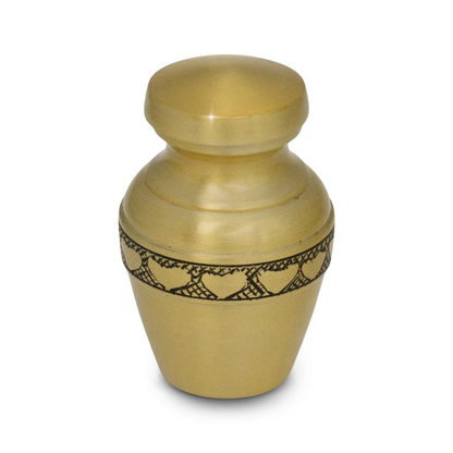 Wide brass keepsake urn with a low profile and a ring of hearts around the body