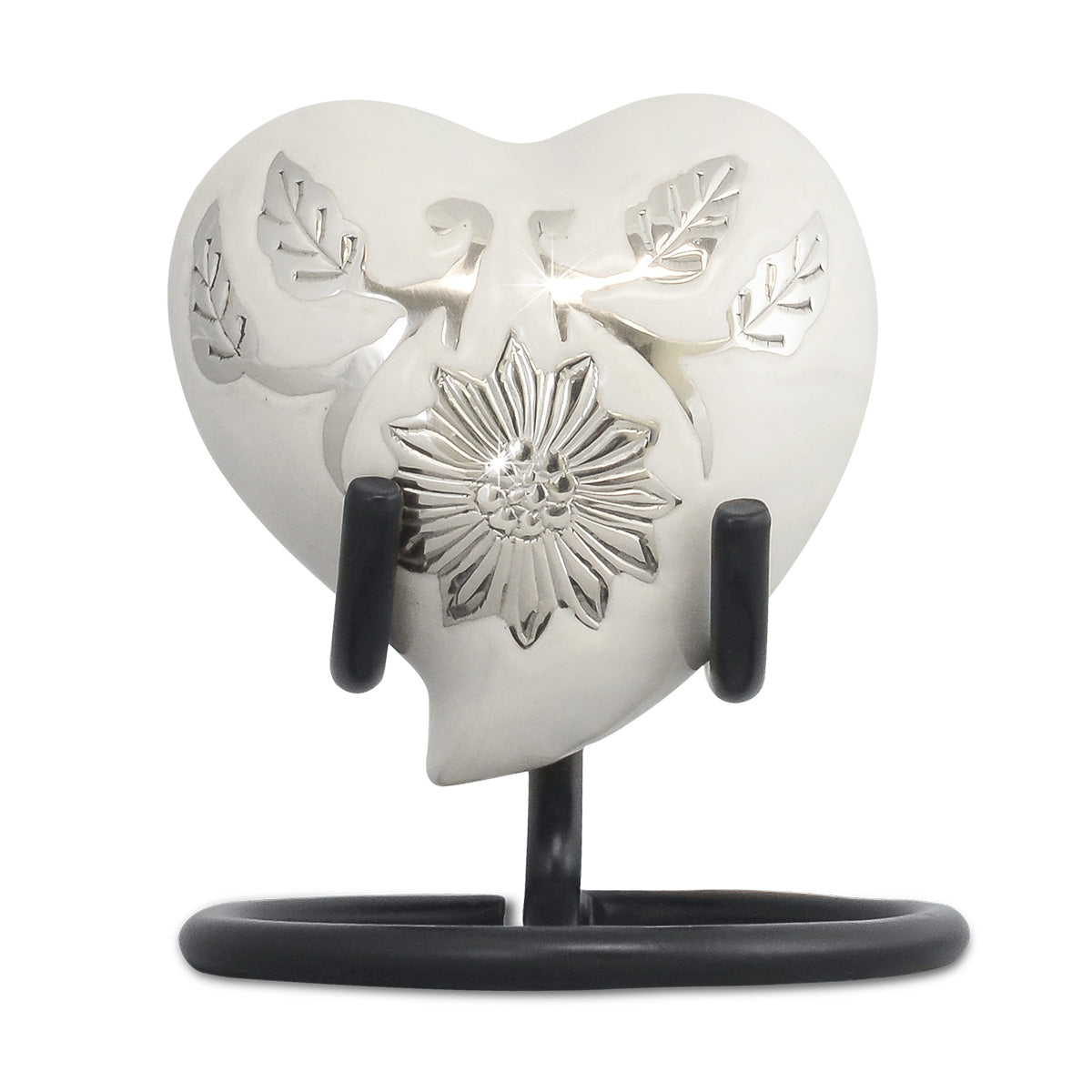 White heart-shaped keepsake urn on a brass body with a smooth unbroken front
