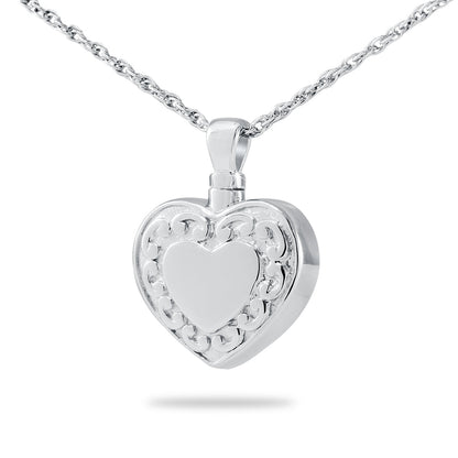 Plain polished silver heart-shaped cremation pendant with an unmarked face, on a chain