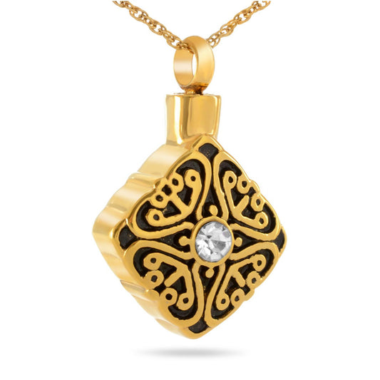 Gold cremation pendant with fine scrollwork framing a cluster of clear crystals