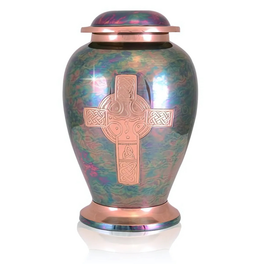 Polished brass cremation urn with a raised cross on the front face and a domed lid