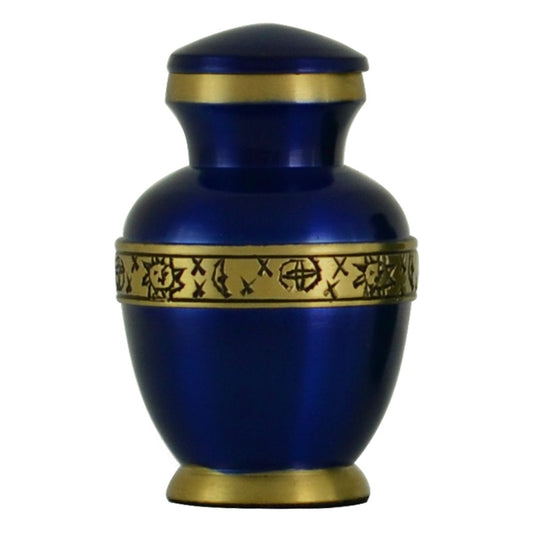 Deep blue brass keepsake urn with a crescent moon and scattered stars on the front
