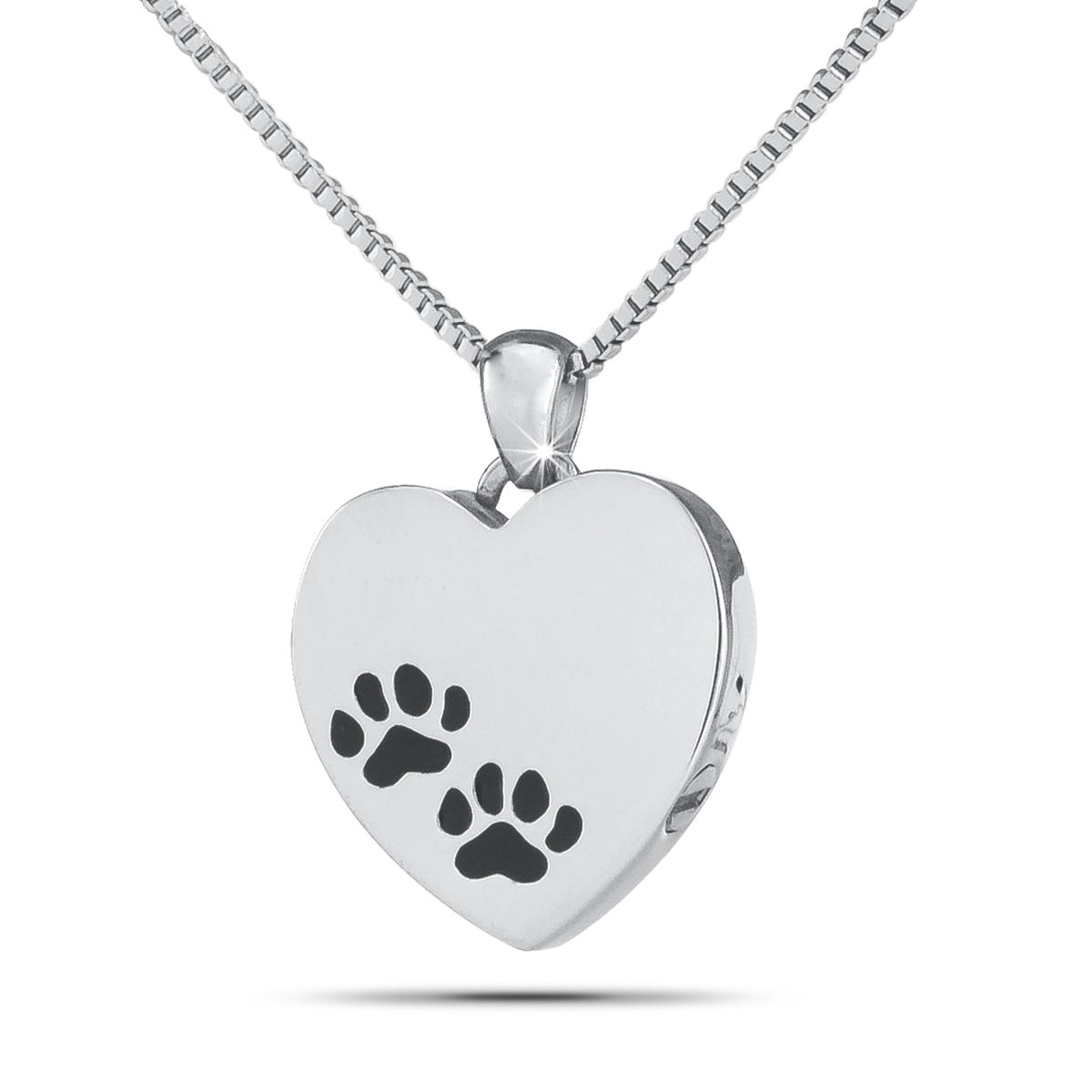 Silver heart-shaped pet keepsake with a raised paw print on the polished front