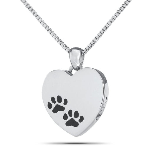 Silver heart-shaped pet keepsake with a raised paw print on the polished front