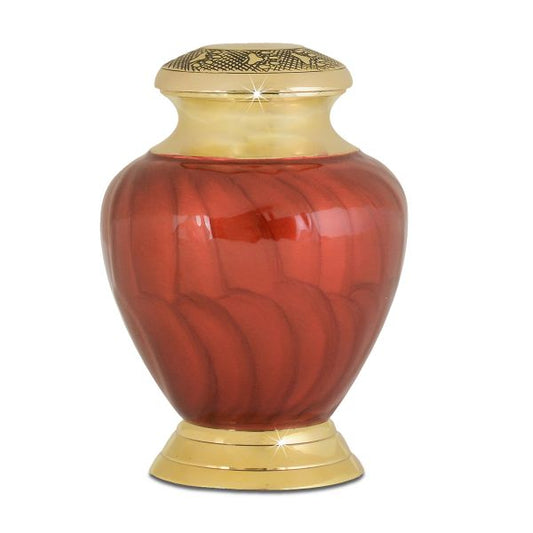 Small brass pet urn with a warm polished finish, about five inches tall, on a square base