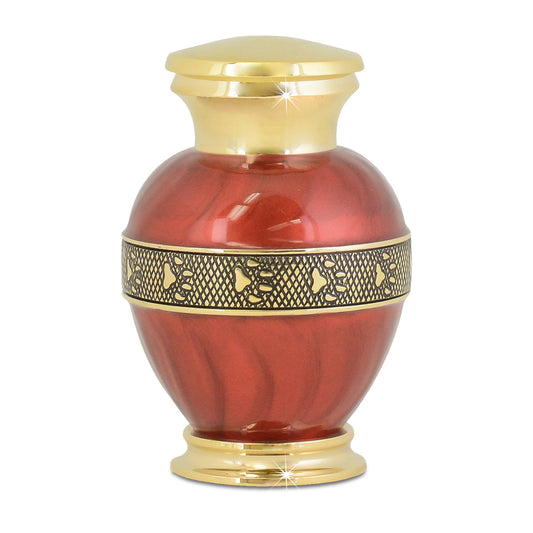 Brass pet cremation urn with a polished gold surface and squared sides, four inches tall