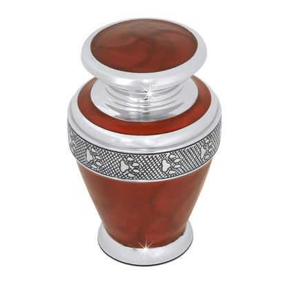 Small chrome-finished pet urn with a mirror-bright surface and softly rounded shoulders