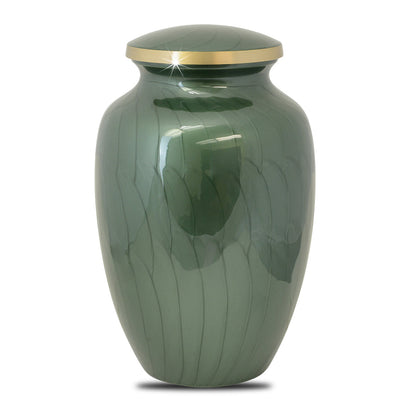 Brass cremation urn with a woodland tree scene worked around the body of the vase