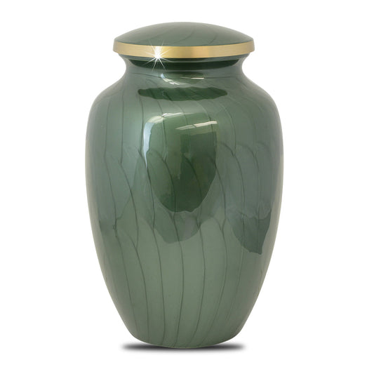 Brass cremation urn with a woodland tree scene worked around the body of the vase