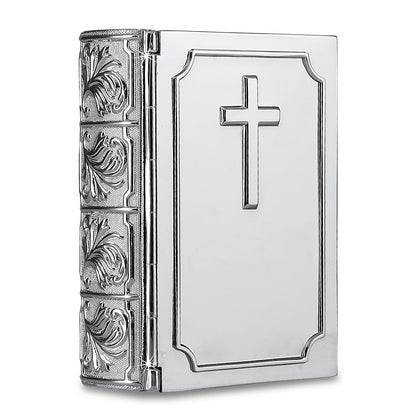 Small metal cremation urn shaped like a closed Bible, lying flat and book-like