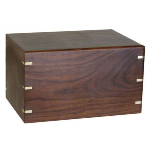 Rectangular wood cremation urn with brass banding and a low flat lid