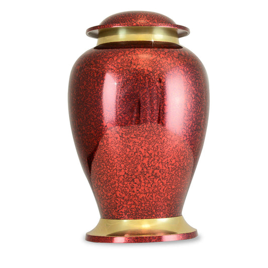 Glossy red cremation urn in brass with a smooth undecorated body and rounded lid