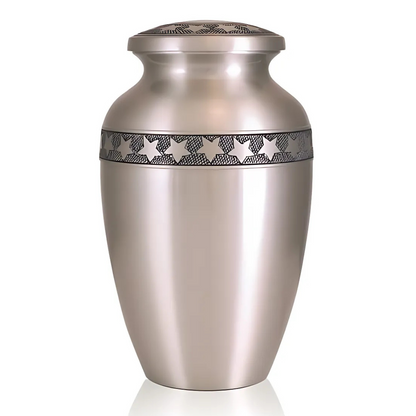Grey pewter finished brass urn with small stars scattered across the rounded body
