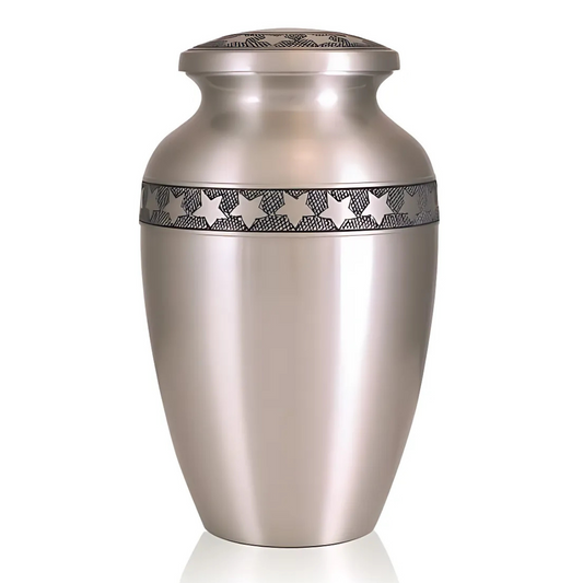 Grey pewter finished brass urn with small stars scattered across the rounded body