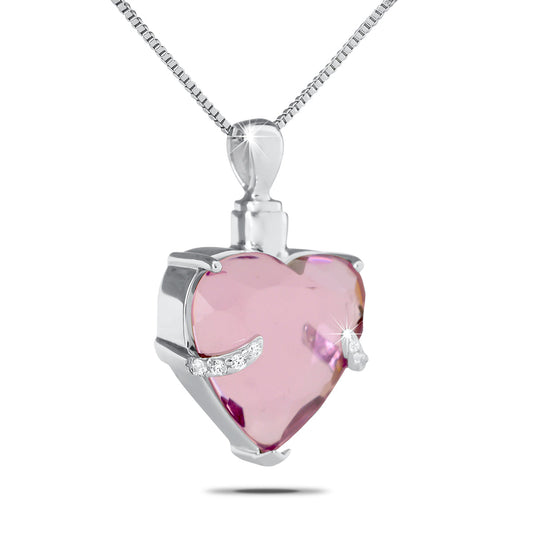 Steel heart keepsake urn one inch wide with a pink crystal set in the center