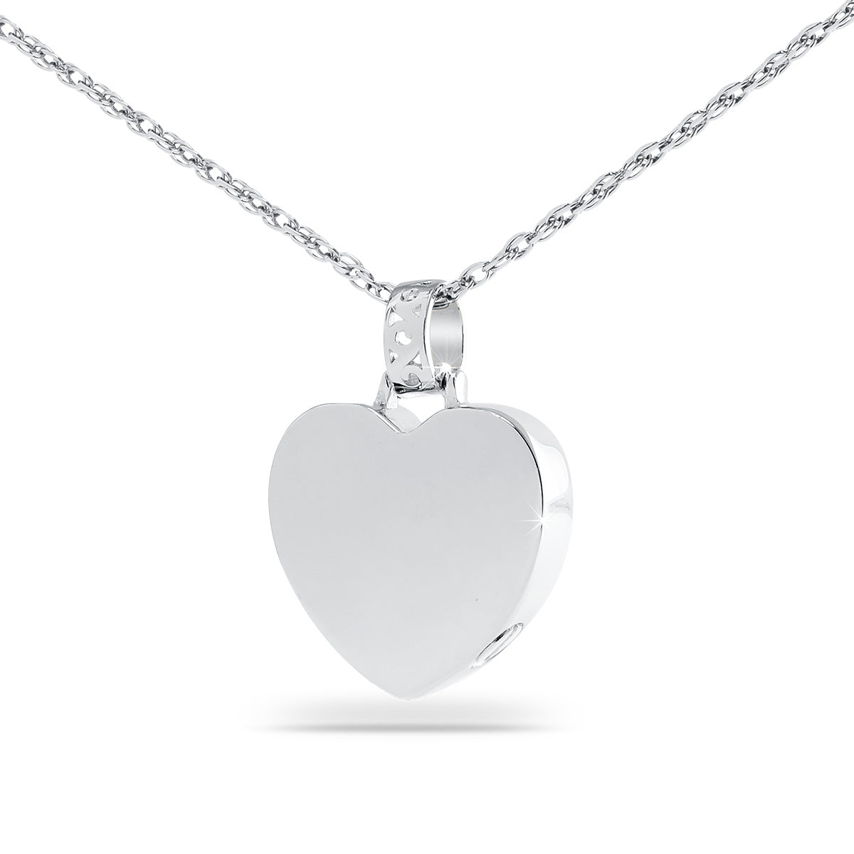 Polished silver heart pendant about one inch tall hanging on a fine chain