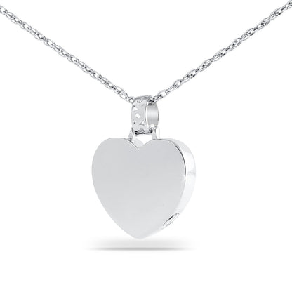 Polished silver heart pendant about one inch tall hanging on a fine chain