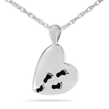 Wide stainless steel pendant engraved with lines from the Footprints prayer and two footprints