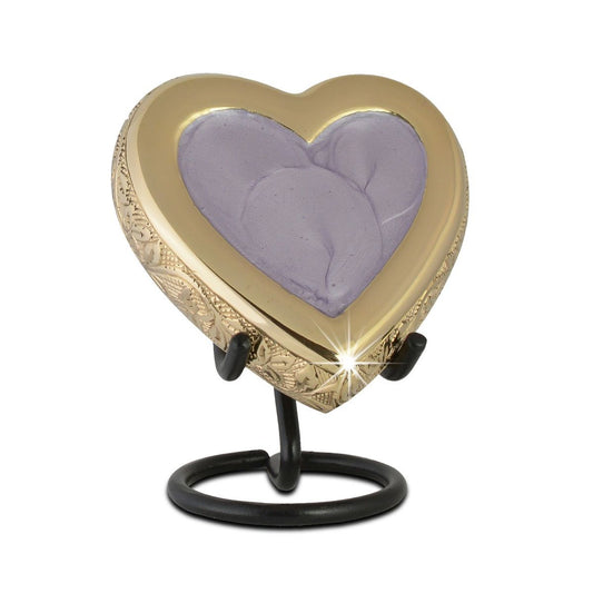 Pale lilac heart-shaped keepsake urn on brass with a smooth front face