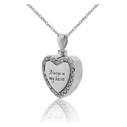 Silver heart pendant set with small white stones, hanging from a silver chain