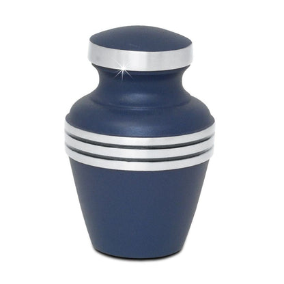 Slim brass keepsake urn finished in deep blue with a narrow neck and lift-off lid