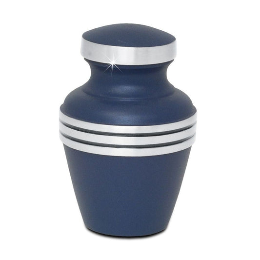 Slim brass keepsake urn finished in deep blue with a narrow neck and lift-off lid