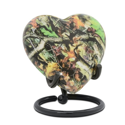 Heart-shaped brass keepsake urn finished in a green and brown camouflage pattern