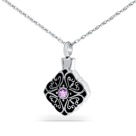 Faceted purple crystal set in a detailed stainless steel pendant with a top opening