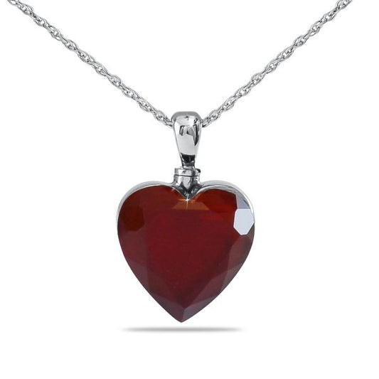 Small stainless steel keepsake urn shaped as a red heart with a polished finish