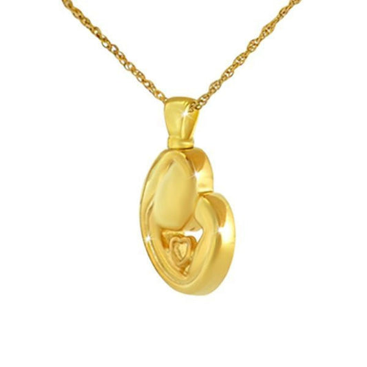 Small gold-toned steel pendant, half an inch wide, with a mother and child motif