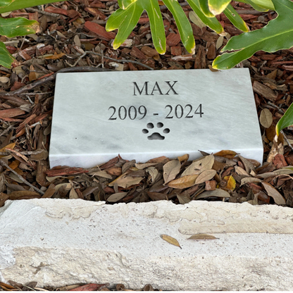 Wide rectangular stone memorial nameplate lying flat, 11.5 inches across