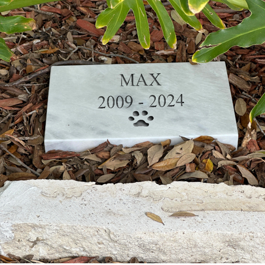 Wide rectangular stone memorial nameplate lying flat, 11.5 inches across